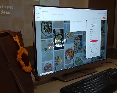 Developer working at a desk with code on screen